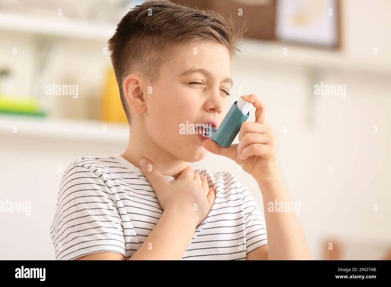 Little boy with inhaler having asthma attack at home Stock Photo Alamy