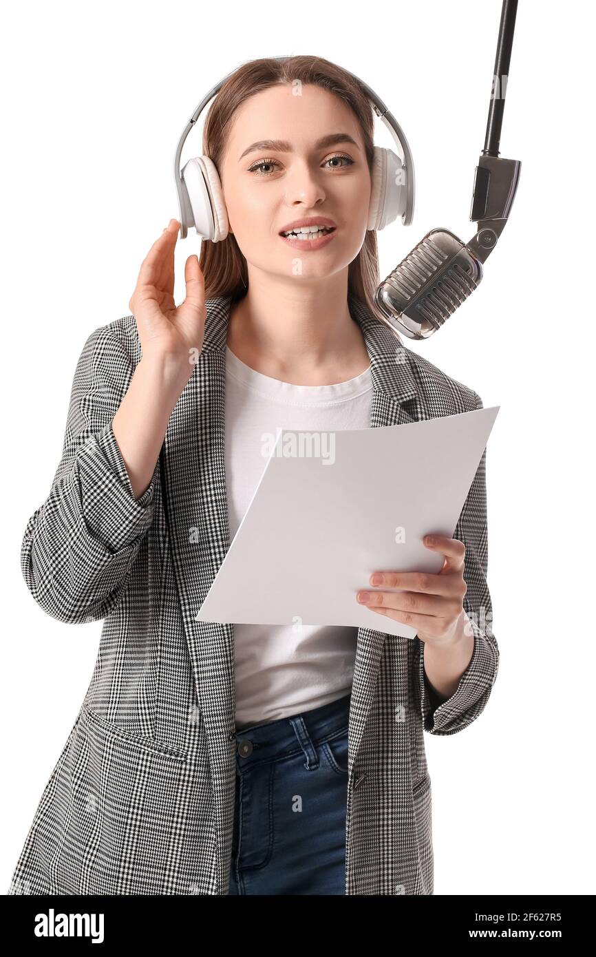 Female radio presenter with microphone on white background Stock Photo