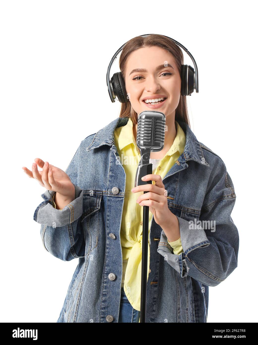 Female radio presenter with microphone on white background Stock Photo