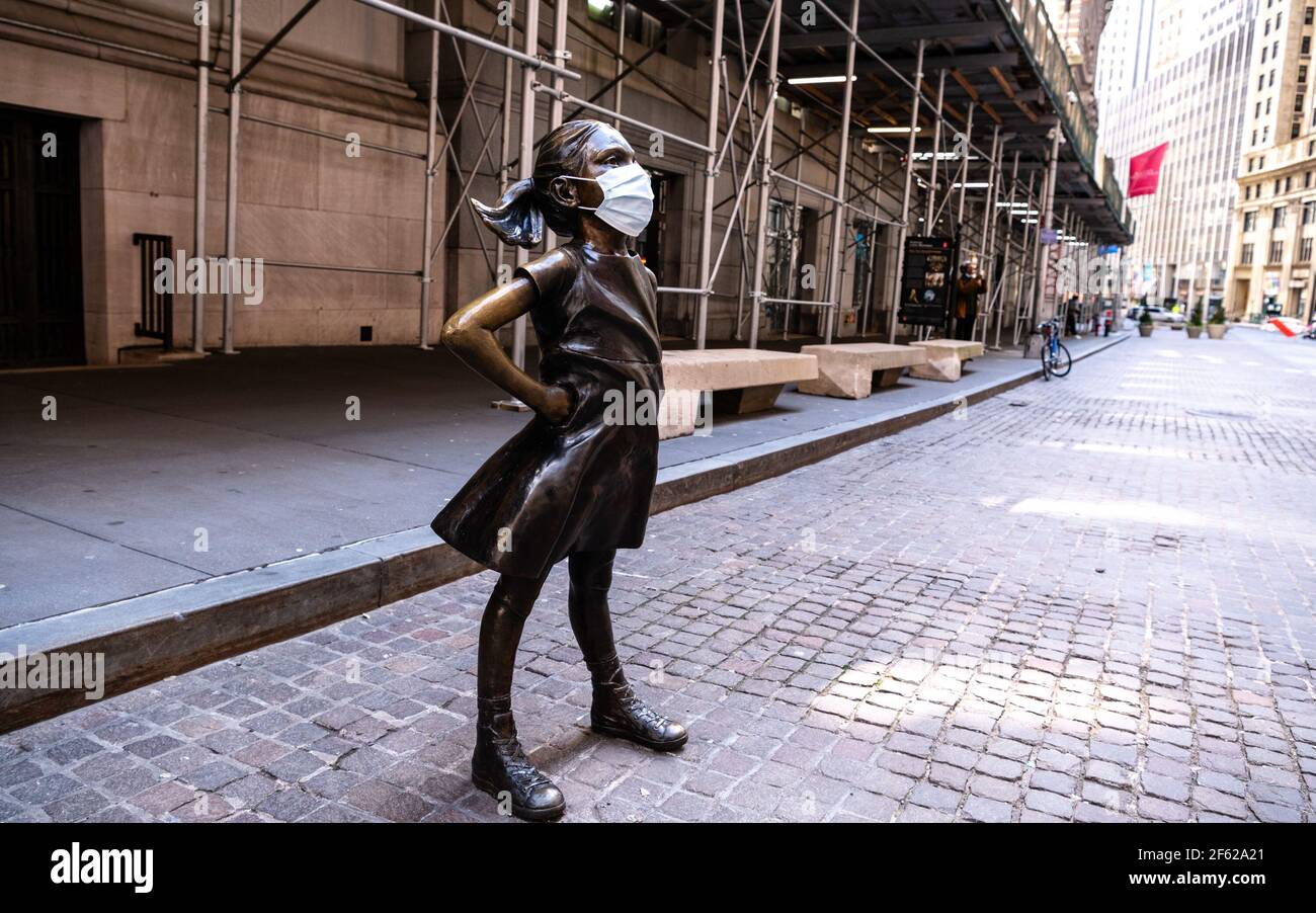 Fearless Girl Statue, Covid-19 Pandemic Stock Photo