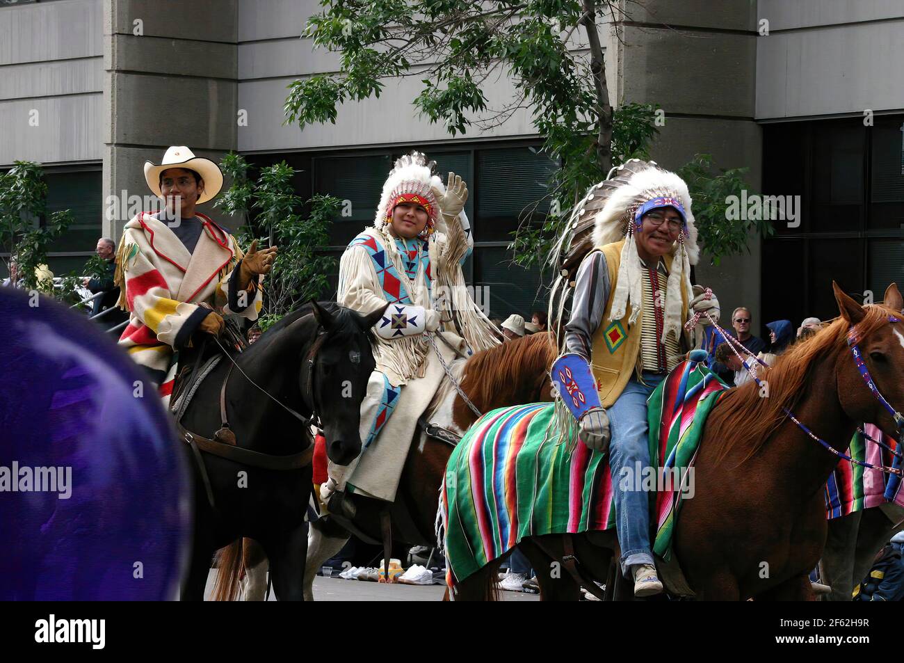 CALGARY,  CANADA - JUL 9, 2004  - First Nations people participate in the  Calgary Stampede Parade,  Alberta, Canada Stock Photo