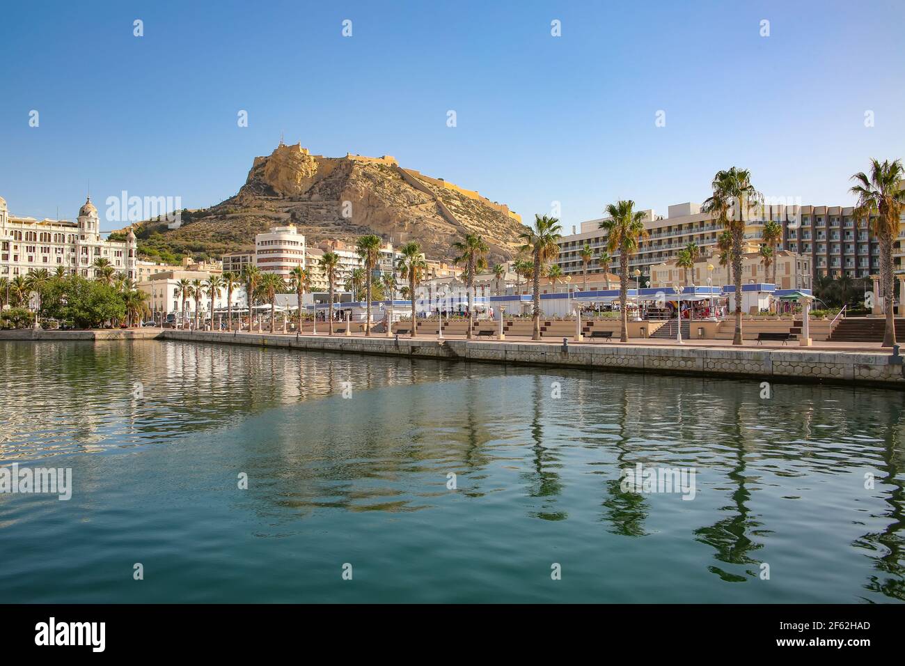 Waterfront and marina of the seaside city with Mount Benacantil, and the Castle of Santa Barbara in the background, Alicante, Costa Blanca, Spain. Stock Photo