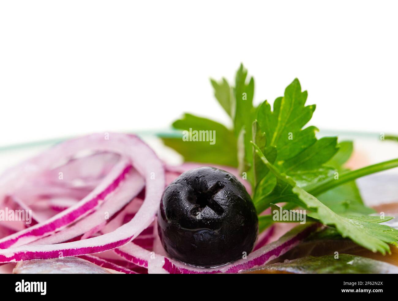 Closeup of black olive and fresh parsley. Macro. Photo can be used as a whole background. Stock Photo