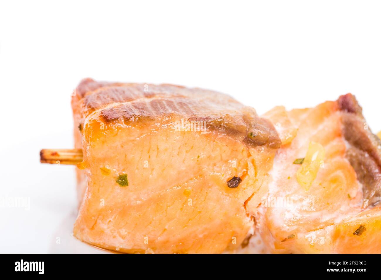 Grilled salmon shish kebab on skewer. Macro. Photo can be used as a