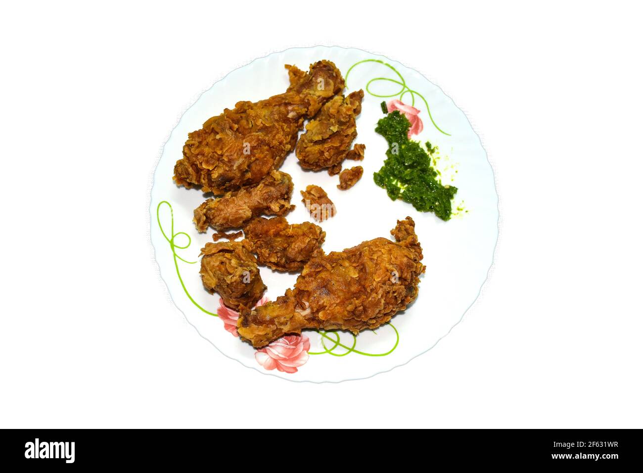 Fried Chicken and green sauce in white plate looks very delicious Stock Photo