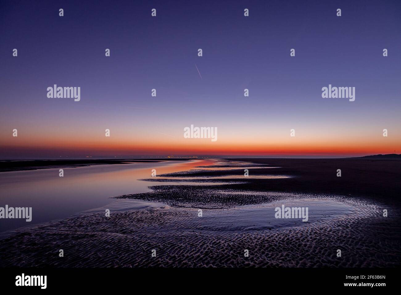 Tidal pools on Talacre beach at dawn, North Wales coast Stock Photo