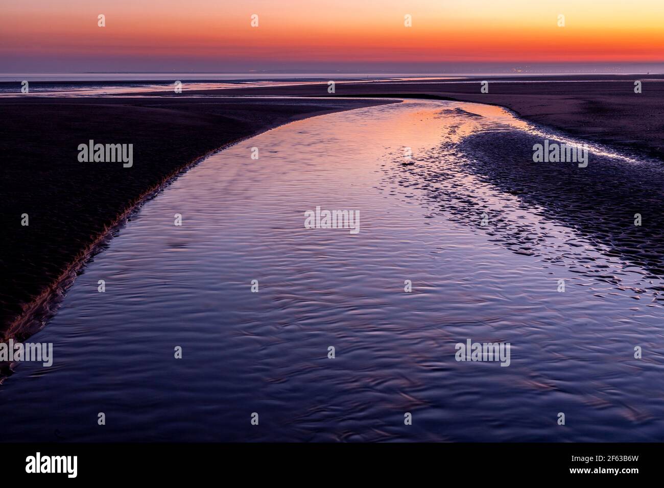 Tidal pools on Talacre beach at dawn, North Wales coast Stock Photo