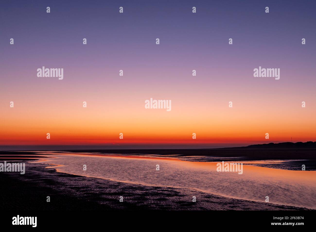 Tidal pools on Talacre beach at dawn, North Wales coast Stock Photo