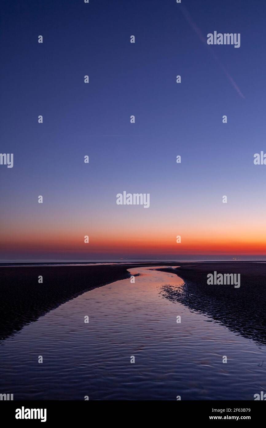 Tidal pools on Talacre beach at dawn, North Wales coast Stock Photo