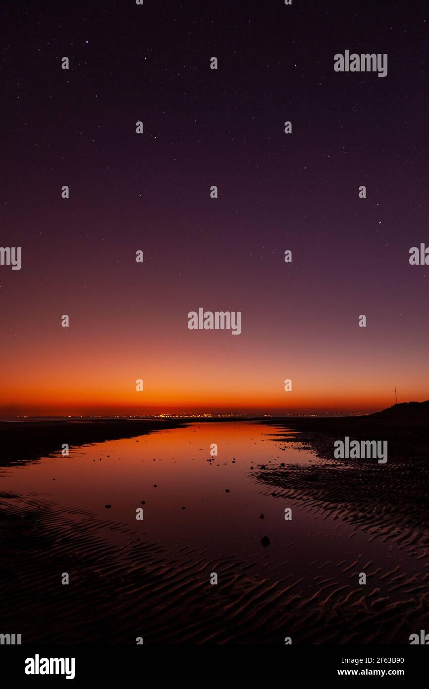 Tidal pools on Talacre beach at dawn, North Wales coast Stock Photo