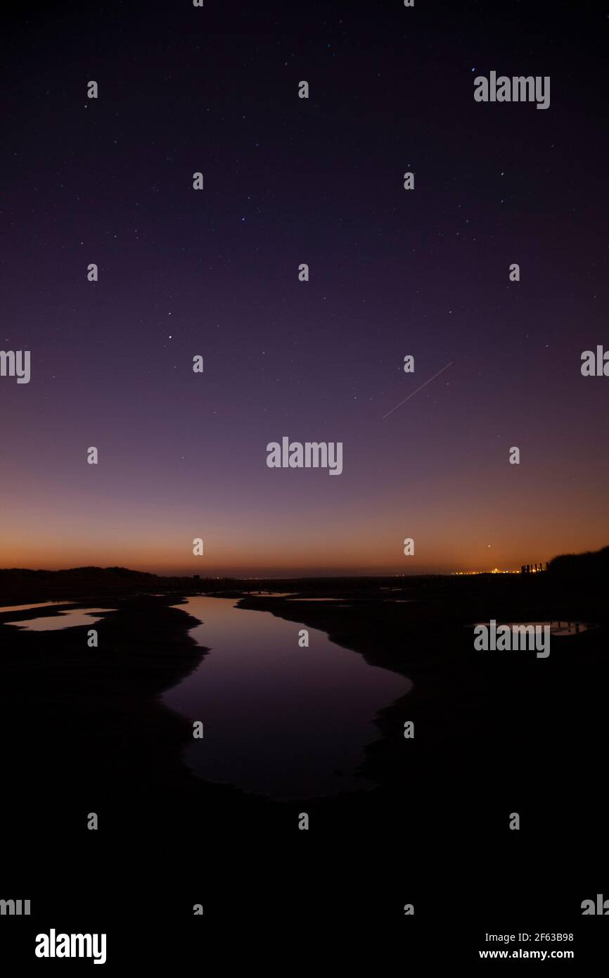 Tidal pools on Talacre beach at dawn, North Wales coast Stock Photo