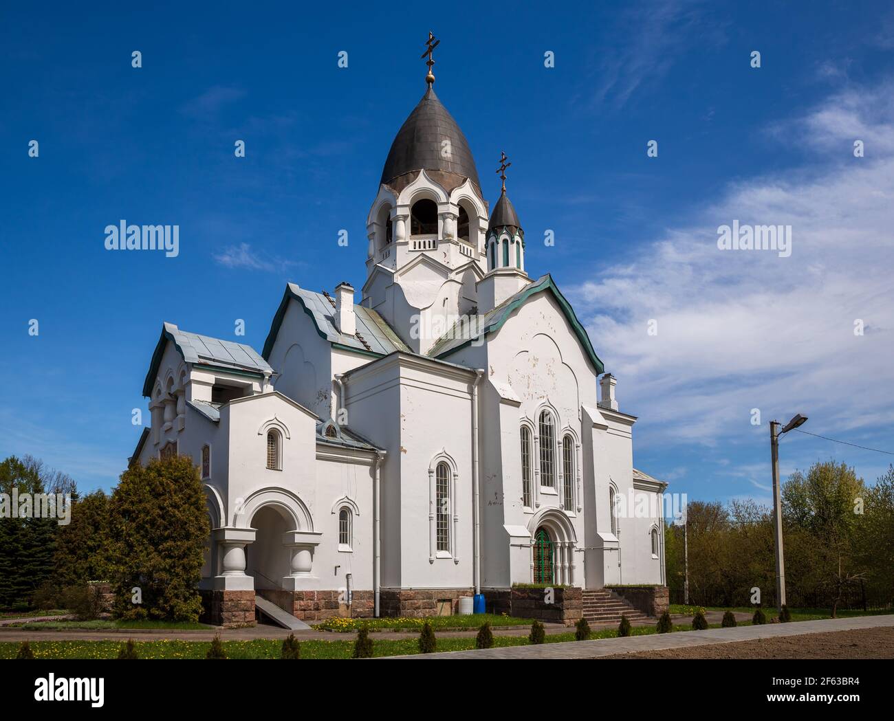 Beautiful Russian church with dark helmet-shaped domes. Church of St. Alexis, Taitsy town, Leningrad region, Russia Stock Photo