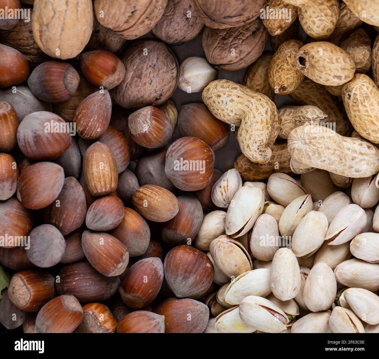 Pistachios, walnuts, hazelnuts, and peanuts in one bowl. Natural, soft