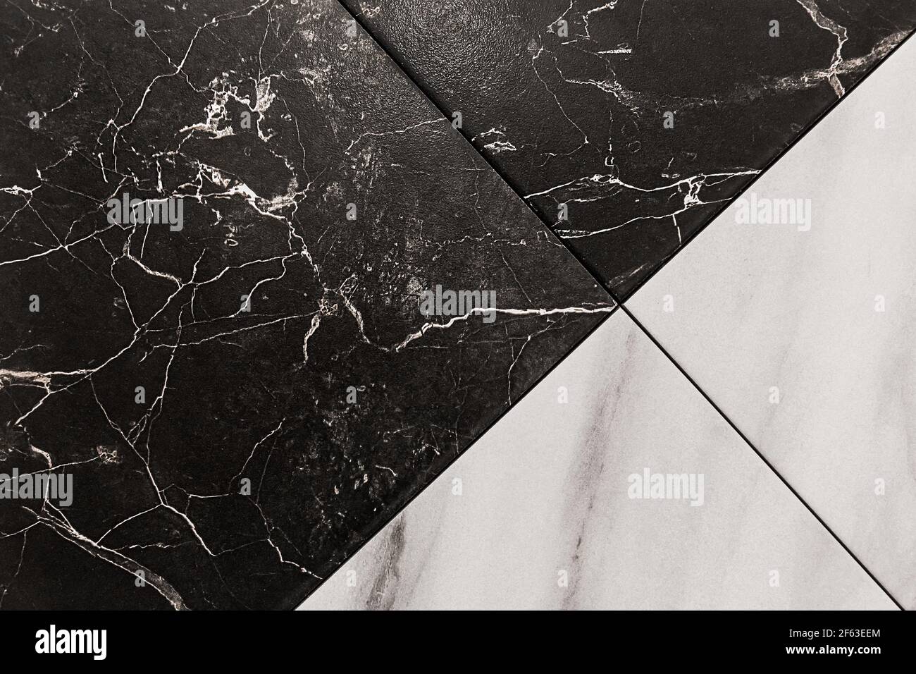 Black and white diagonal ceramic tiles with abstract cracks pattern