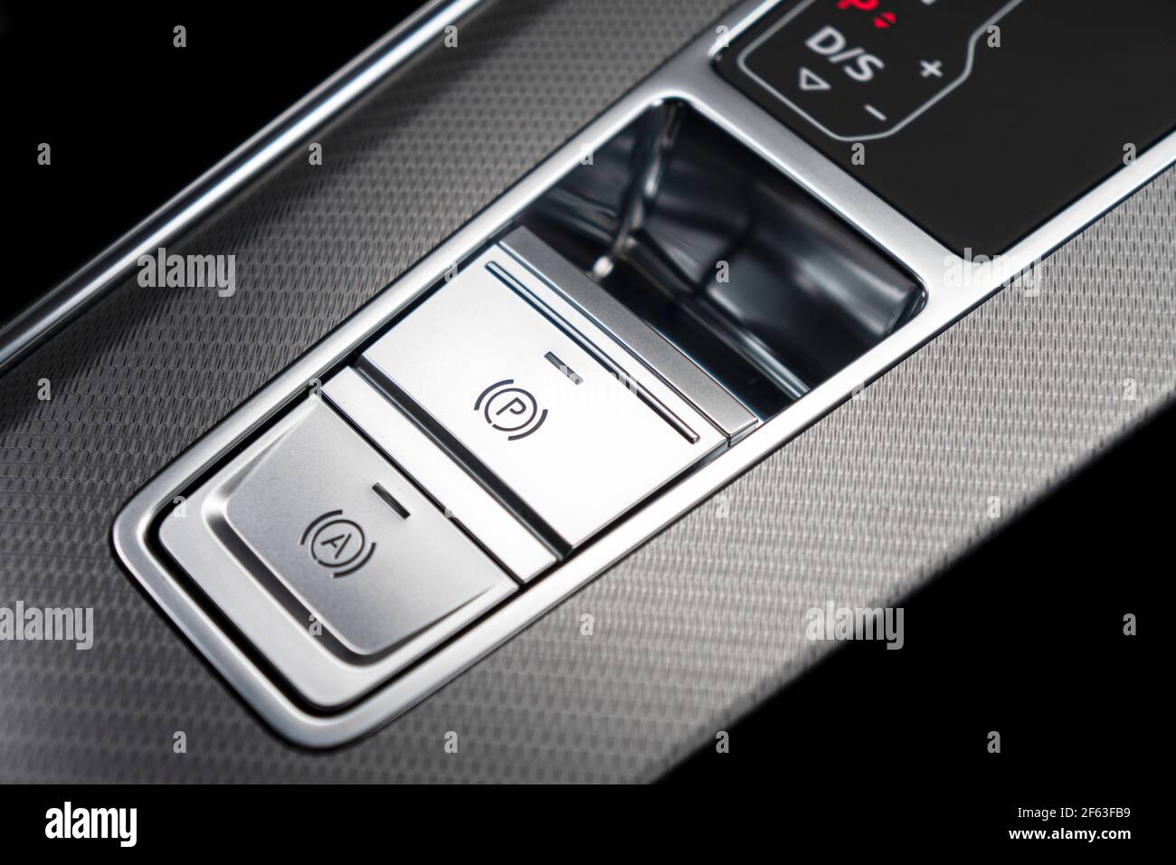 Detail of a parking brake in a nodern car. Electronic parking brake button in a modern car