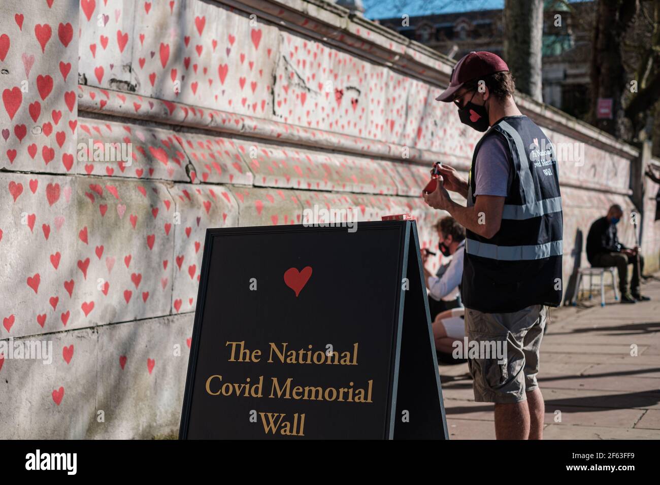 It has been over a Year since Coronavirus struck and shutdown the UK; Today Near St Thomas Hospital a National Memorial has been set up to allow peopl Stock Photo