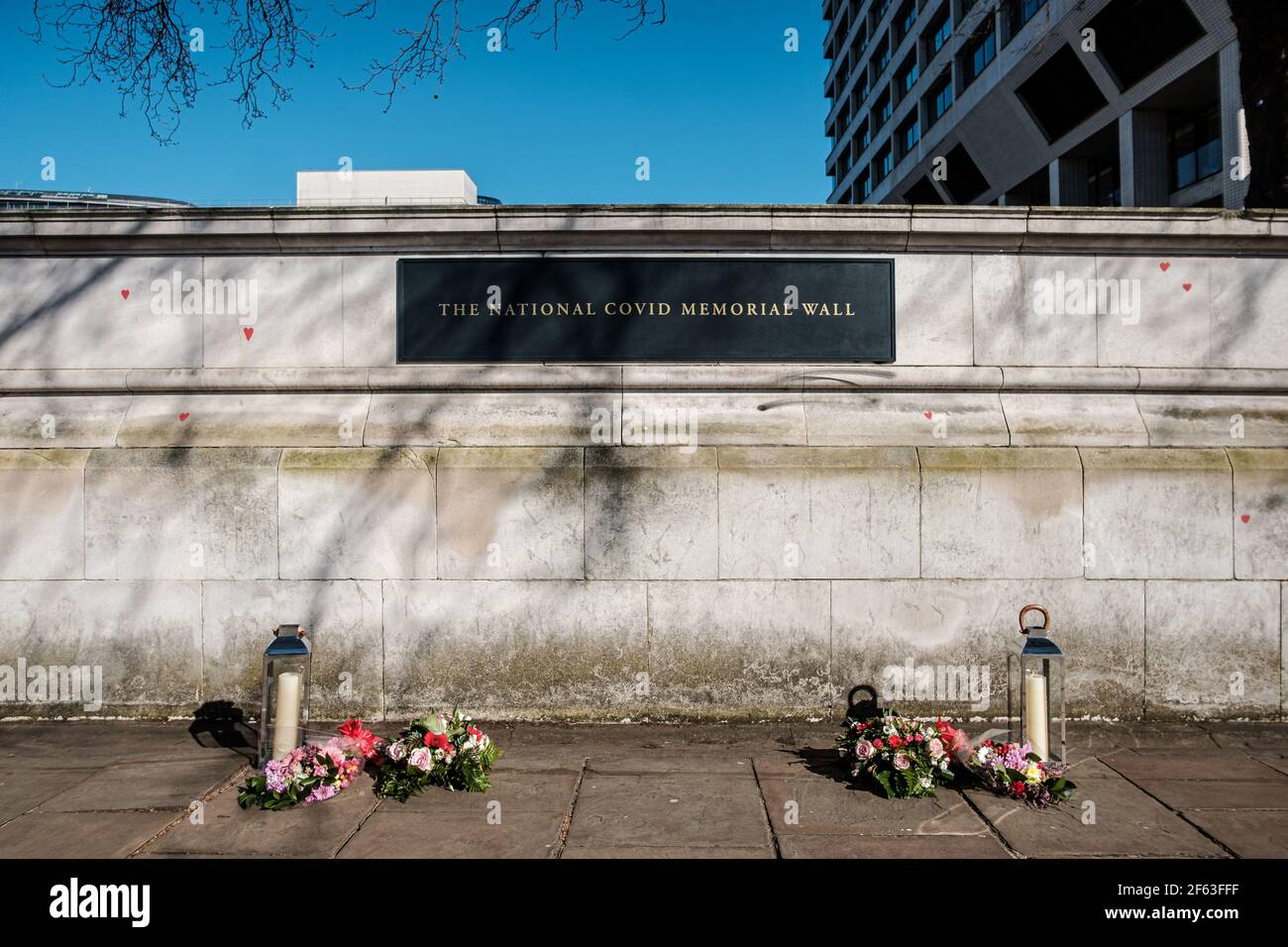 It has been over a Year since Coronavirus struck and shutdown the UK; Today Near St Thomas Hospital a National Memorial has been set up to allow peopl Stock Photo