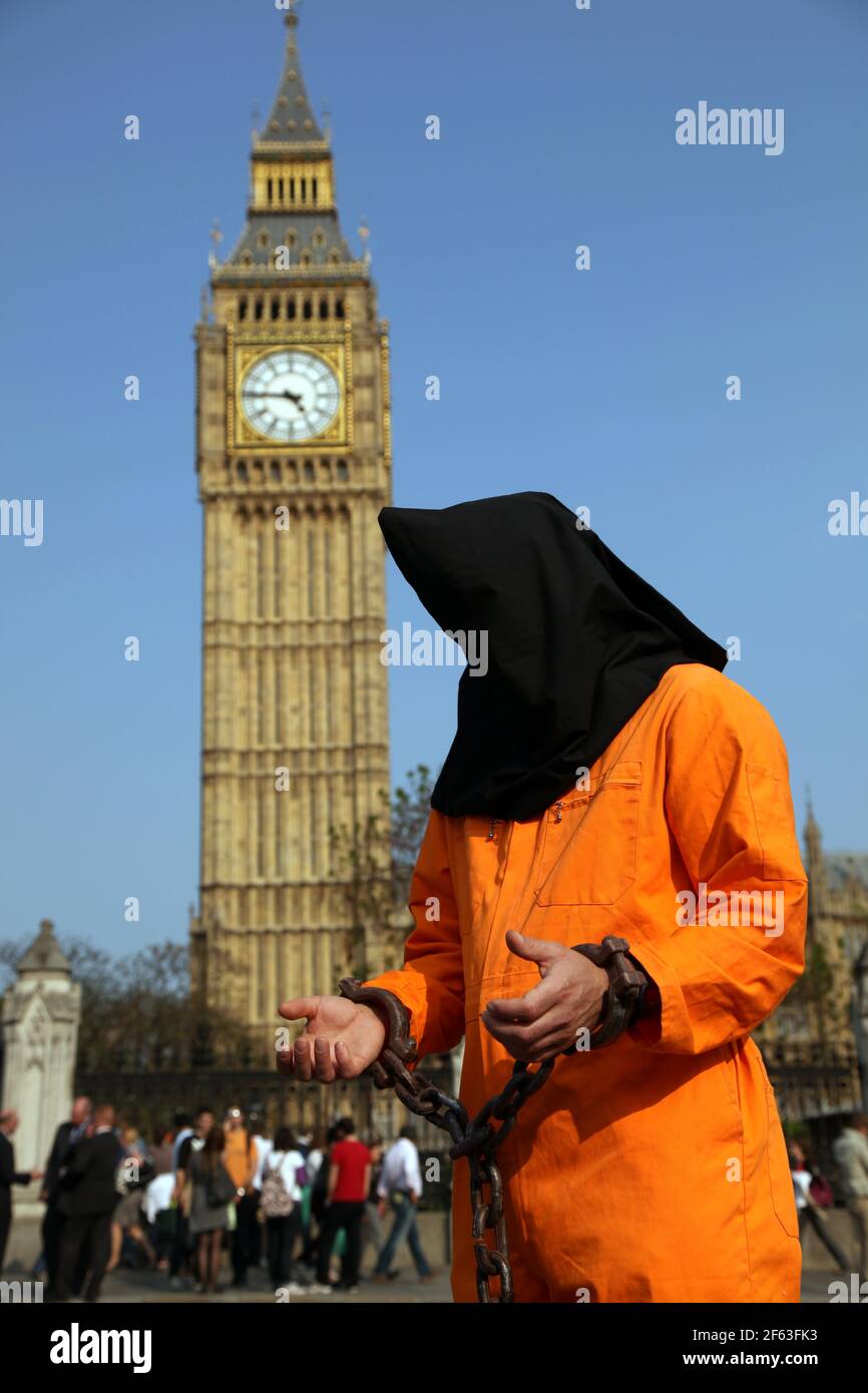 21 April 2011. London, England. A Guantanamo Bay protestor stands outside Big Ben and the Houses of Parliament, part of the Royal wedding route the pr Stock Photo