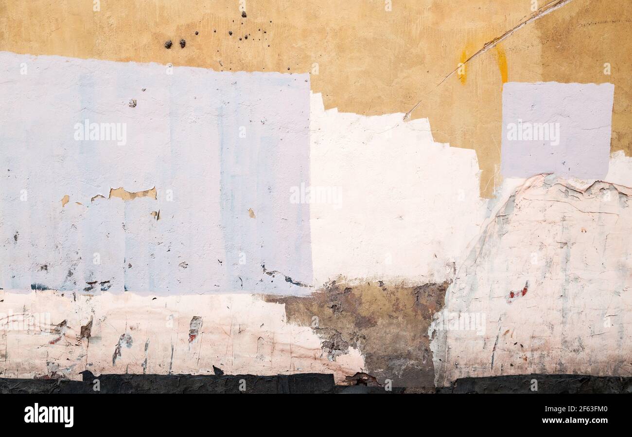 Old concrete wall with paint layers, abstract urban background photo texture Stock Photo