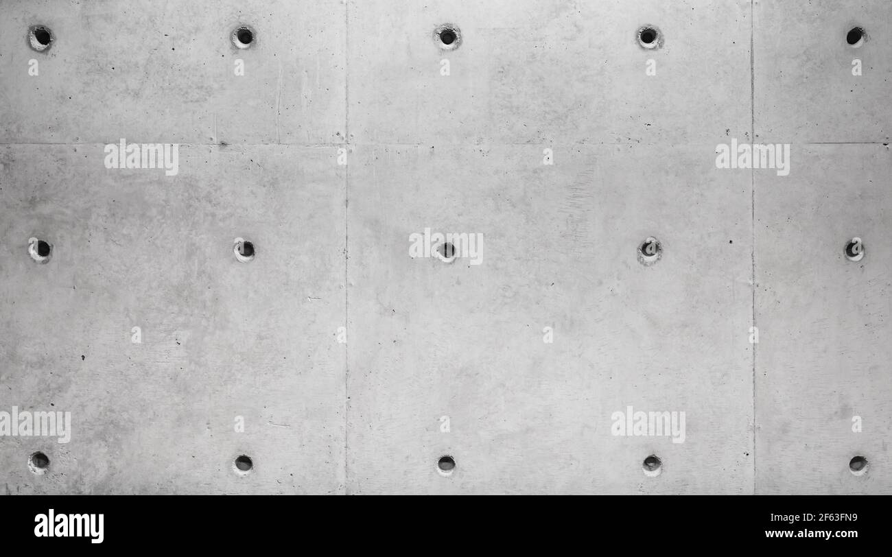New gray concrete wall with technological holes, background photo texture Stock Photo