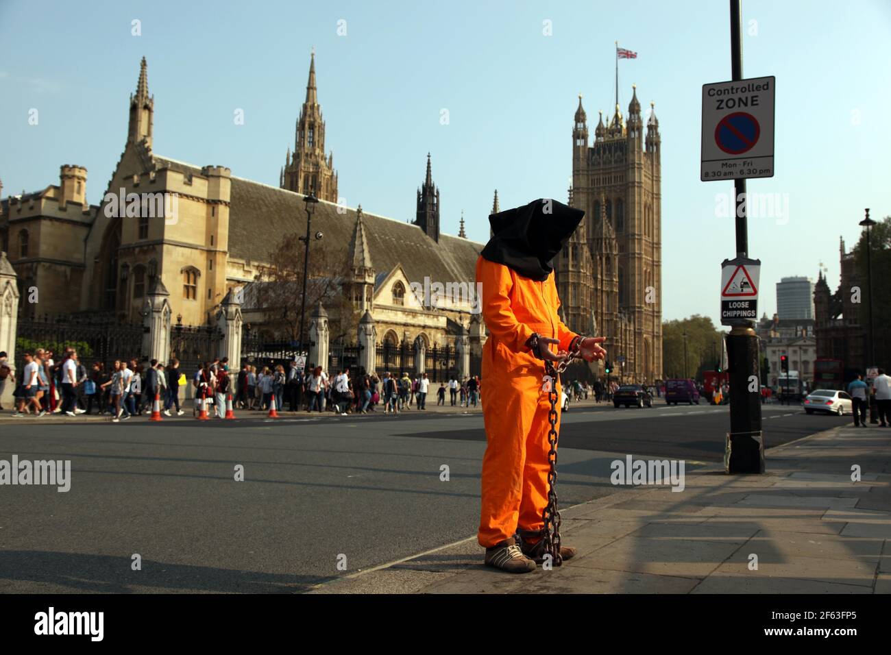 21 April 2011. London, England. A Guantanamo Bay protestor stands outside Big Ben and the Houses of Parliament, part of the Royal wedding route the pr Stock Photo
