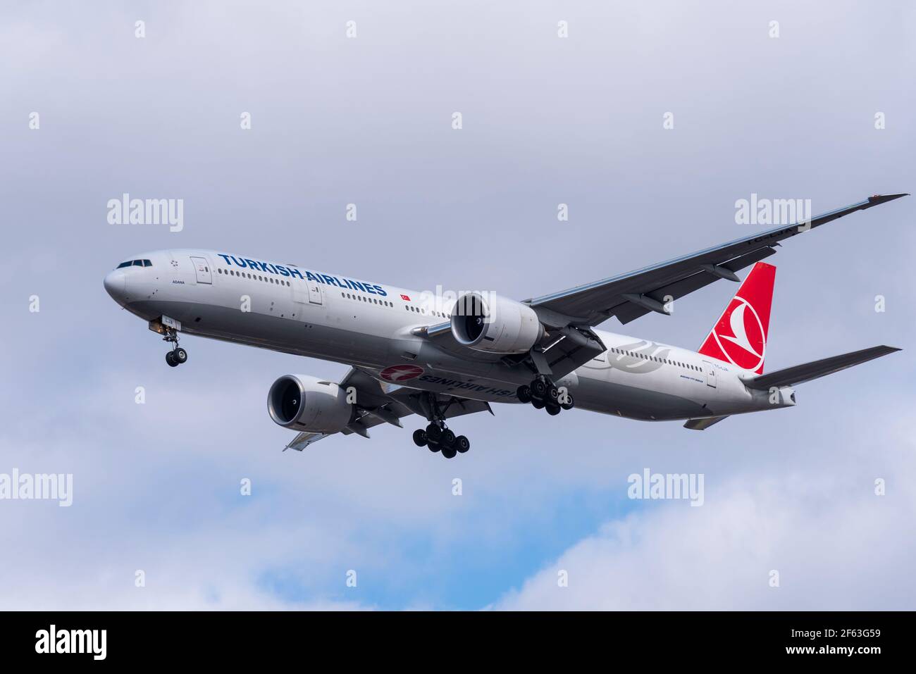 Turkish Airlines Boeing 777 300 ER Extended Range jet airliner plane TC-LJA on finals to land at London Heathrow Airport, UK, in overcast sky. Stock Photo