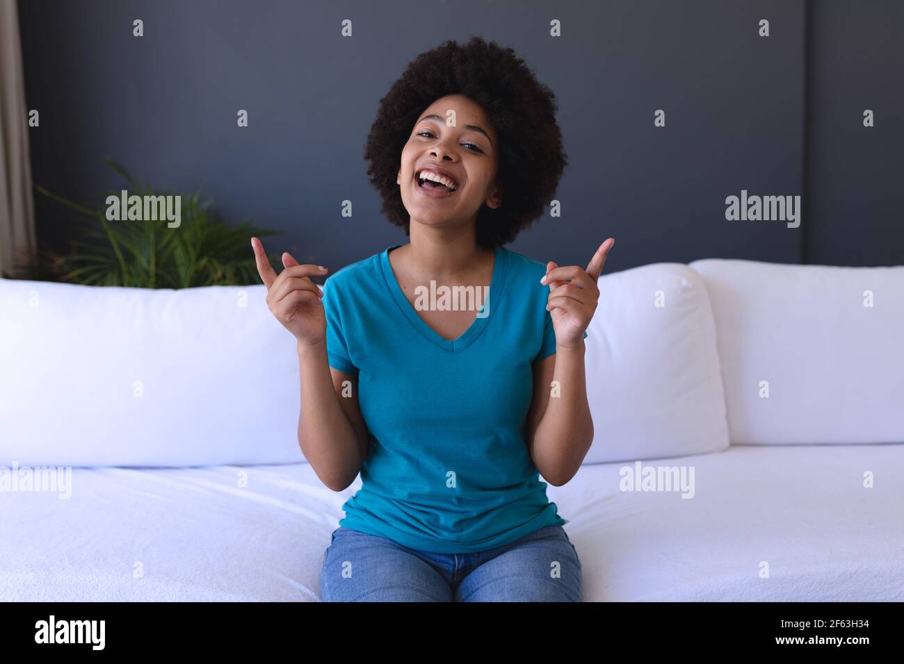 Smiling african american woman making hi-res stock photography and ...