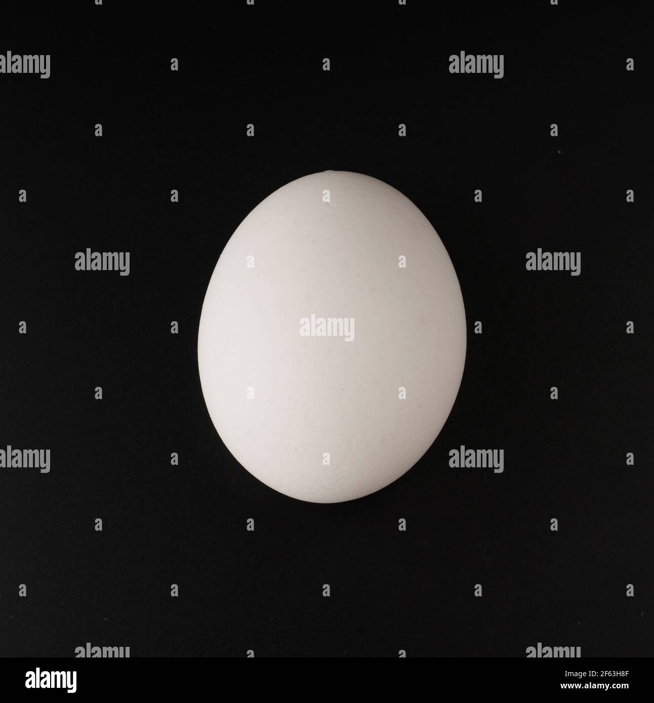 chicken eggs on black background Stock Photo - Alamy