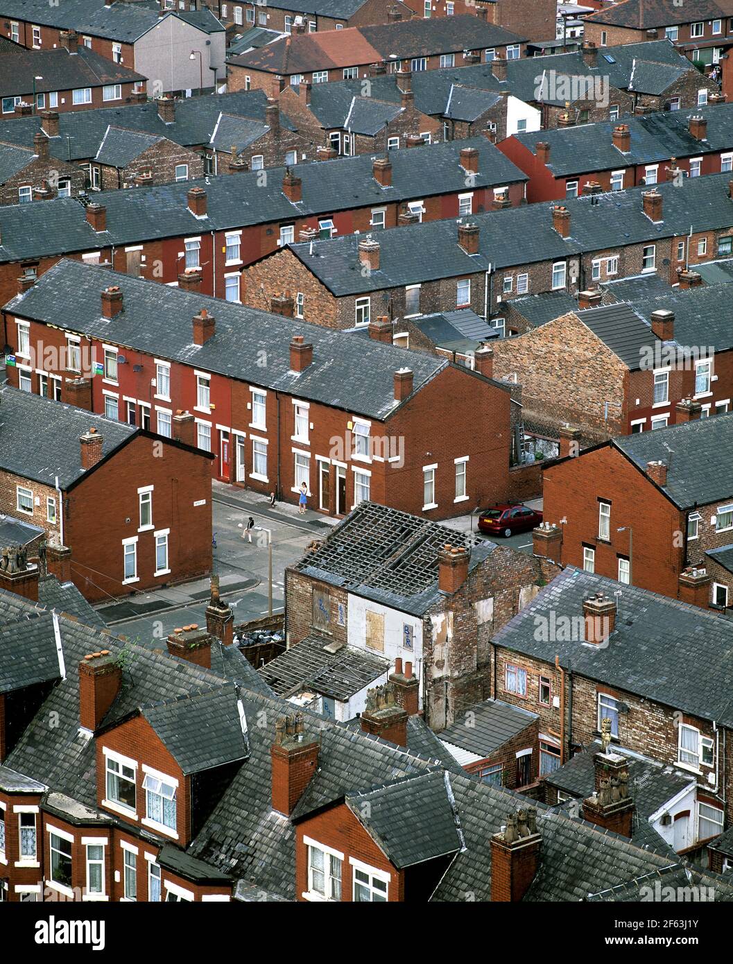 A derelict house in Santley St, Longsight, Manchester, M12.  Photograph taken in 2003. Stock Photo