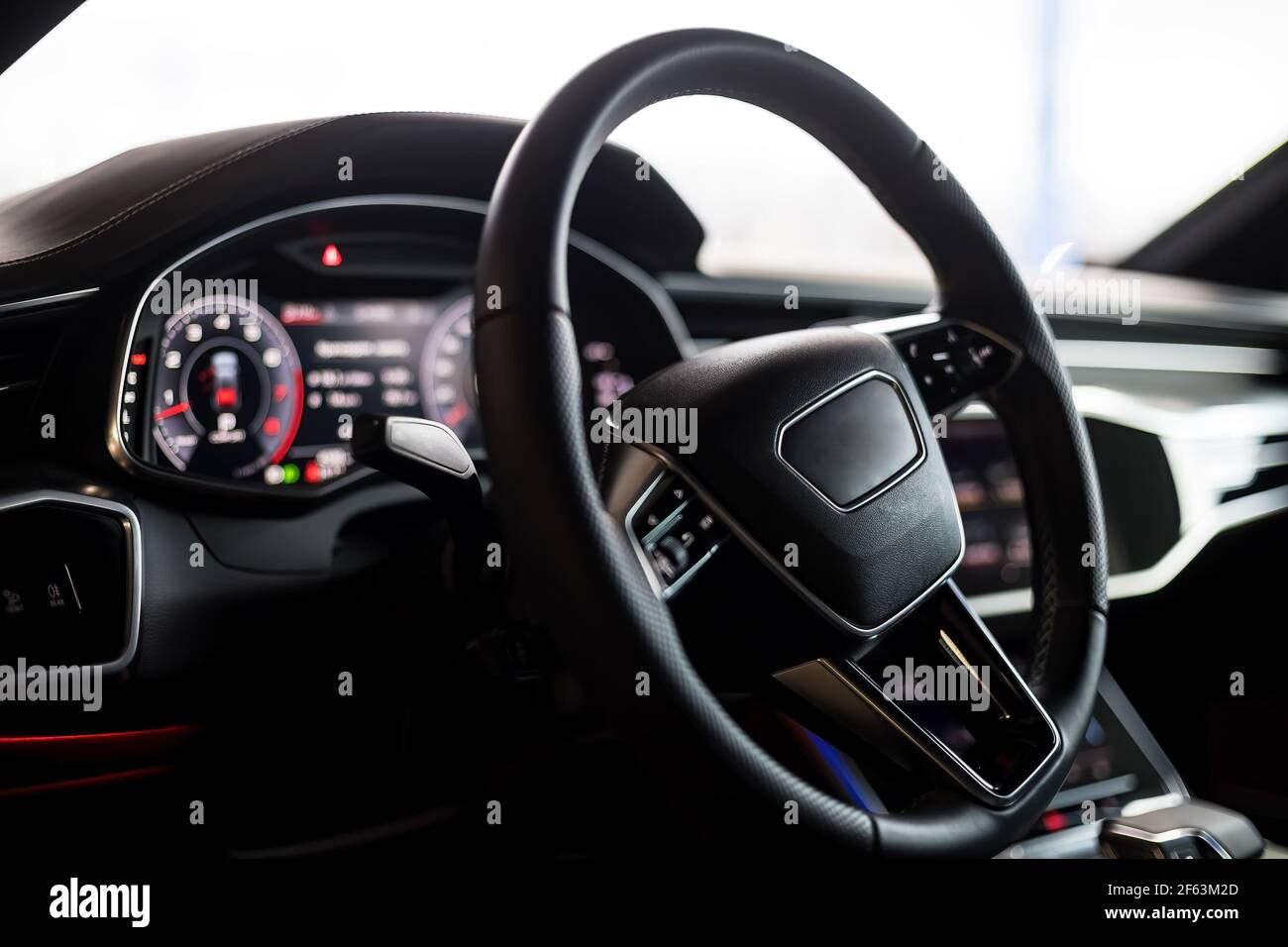 Interior of an ultra modern new luxury car. Leather chairs and wood