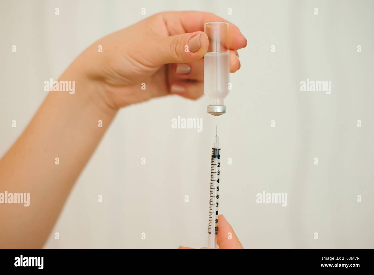 A girl fills a syringe for insulin injections. Diabetes. The shortacting insulin. Insulin