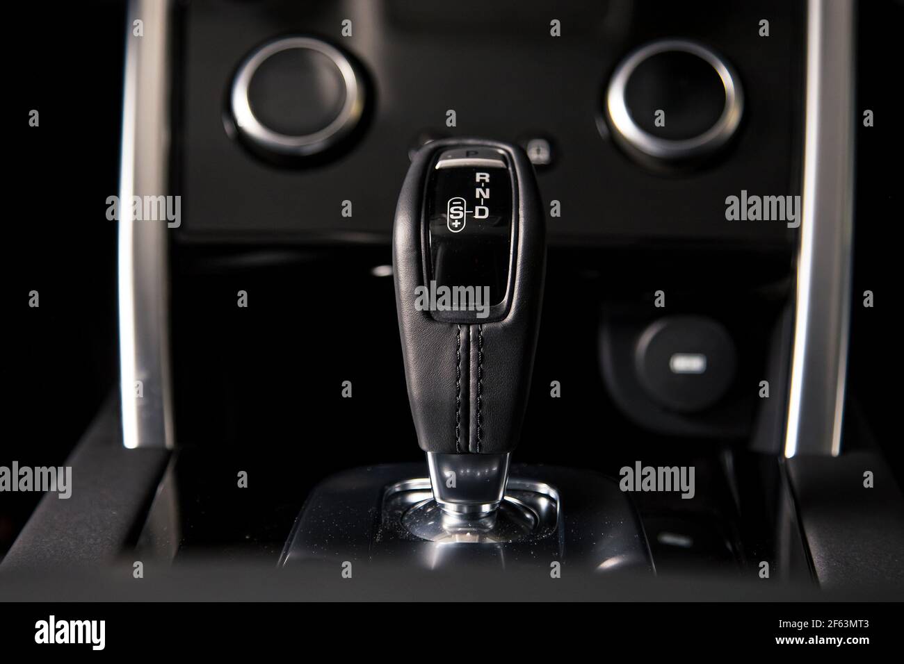 Interior of luxury suv car with black leather steering wheel and