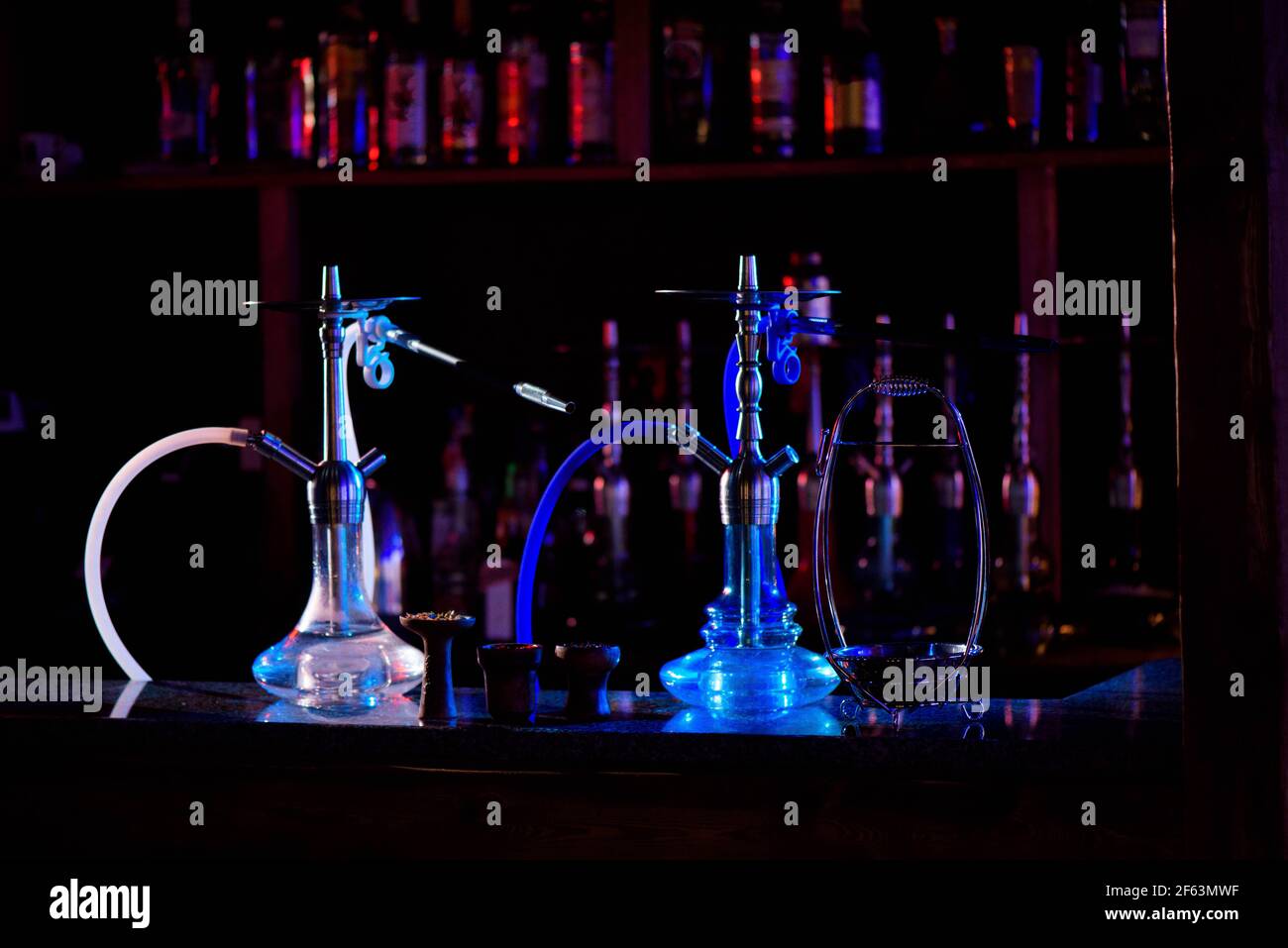 Group of eastern hookahs on table of a bar. Stock Photo