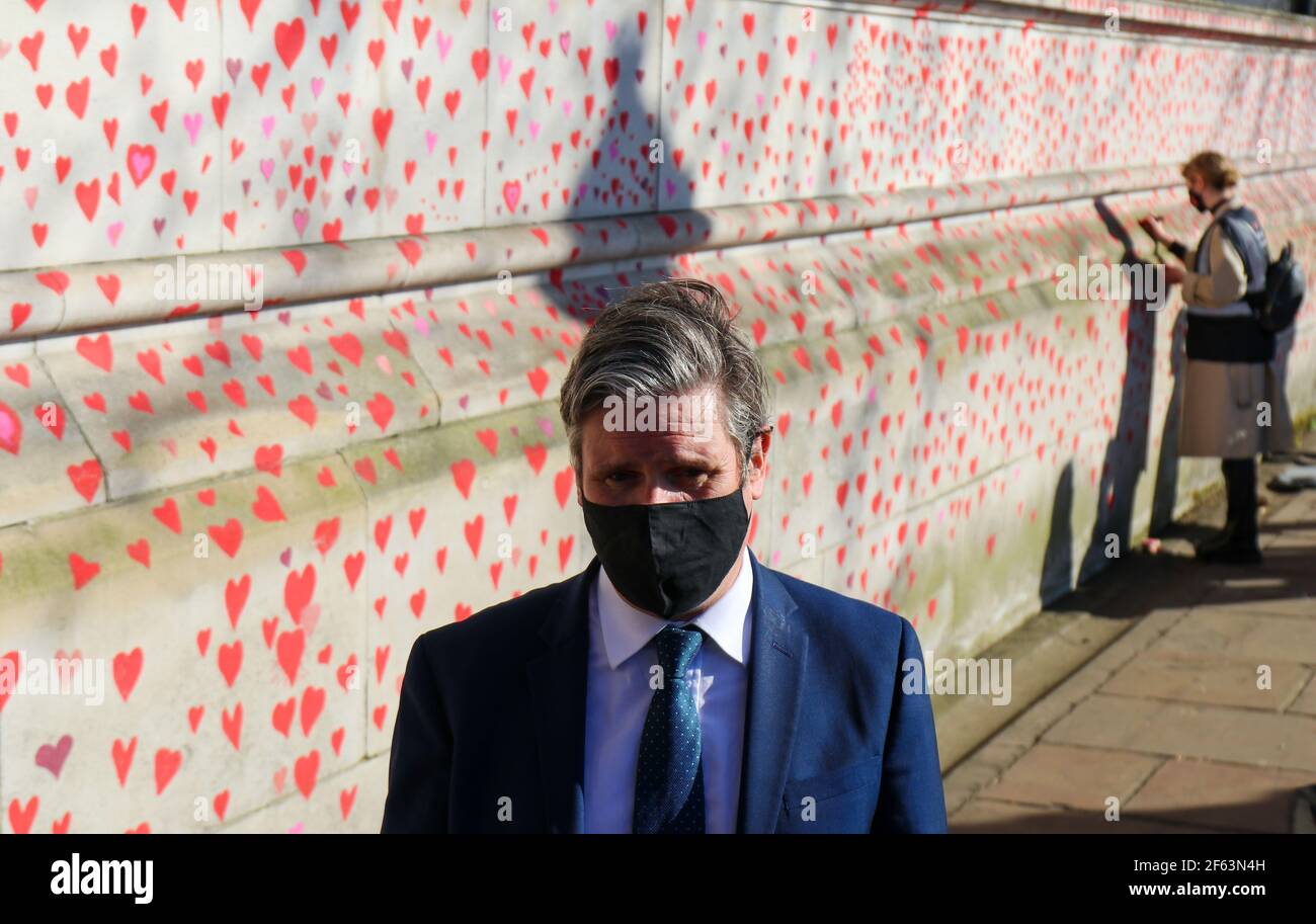 LONDON, UK. MARCH 29TH: Labour Leader Keir Starmer Visits The National Covid-19 Memorial Wall on London's South Bank opposite The Houses of Parliament, each red heart represents one of the 150,000 victims who have died during the Pandemic pictured on Monday 29th March 2021. (Credit: Lucy North | MI News) Credit: MI News & Sport /Alamy Live News Stock Photo