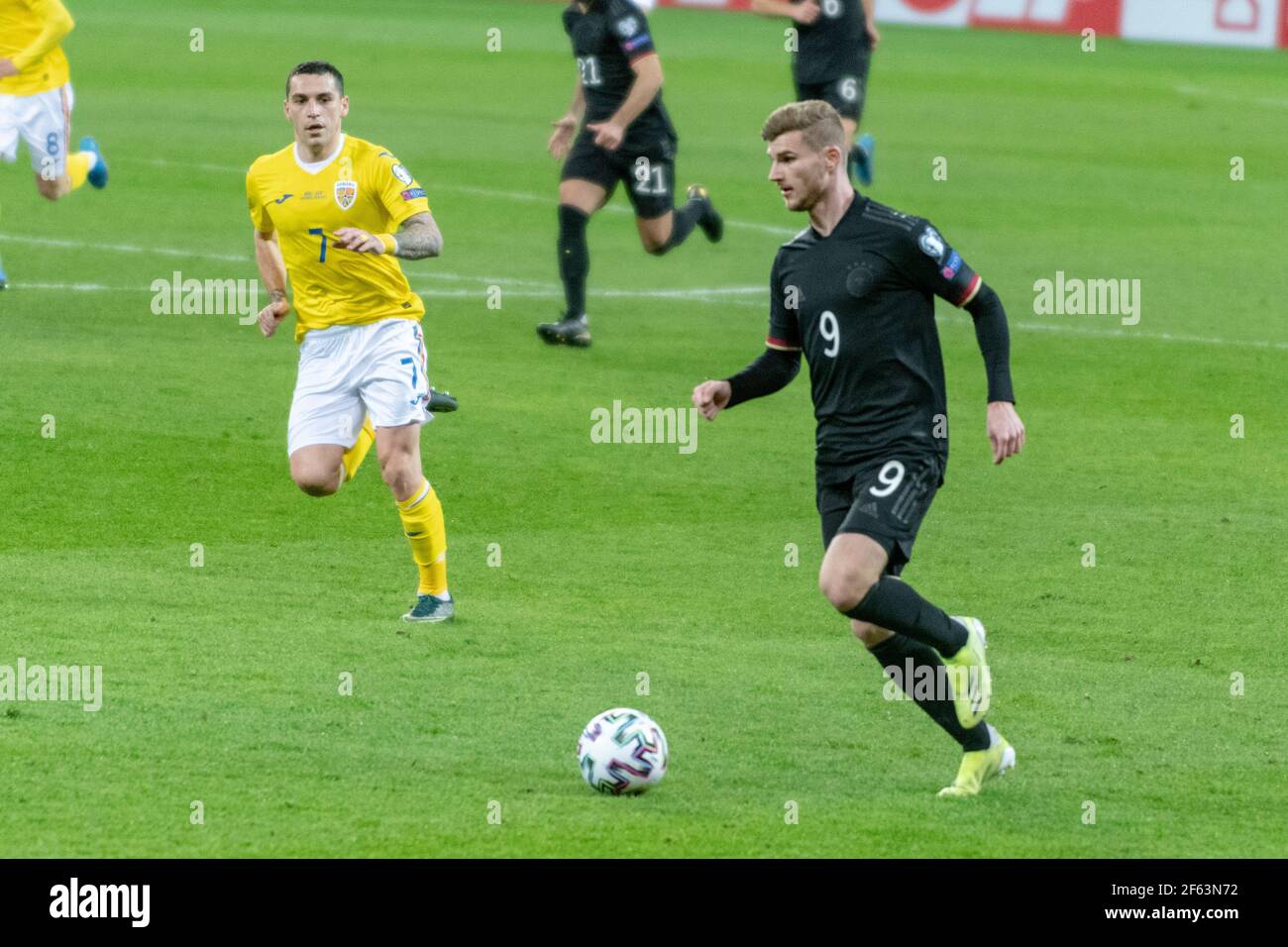 Bucharest, Romania. 28th Mar, 2021. Timo Werner #9 of Germany and Nicolae Stanciu #7 of Romania during the FIFA World Cup 2022 Qualifying Round match between the national teams of Romania and Germany at National Arena in Bucharest, Romania. 28.03.2021. Photo: Copyright 2020, Credit: Cronos/Alamy Live News Stock Photo
