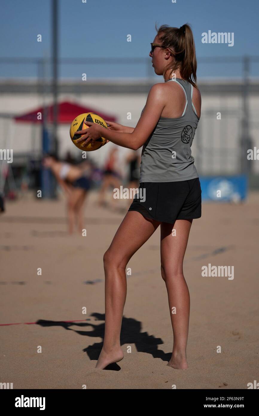 A tall blonde teenage girl competes in the sport of beach volleyball Stock Photo Alamy