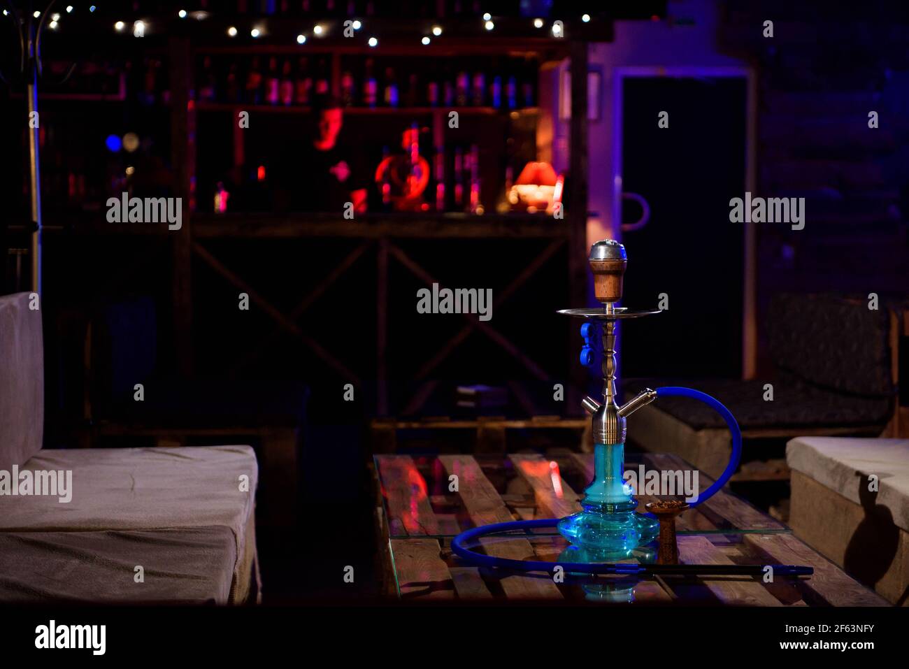 Hookah on the background of a bar, light, smoke, smog Stock Photo