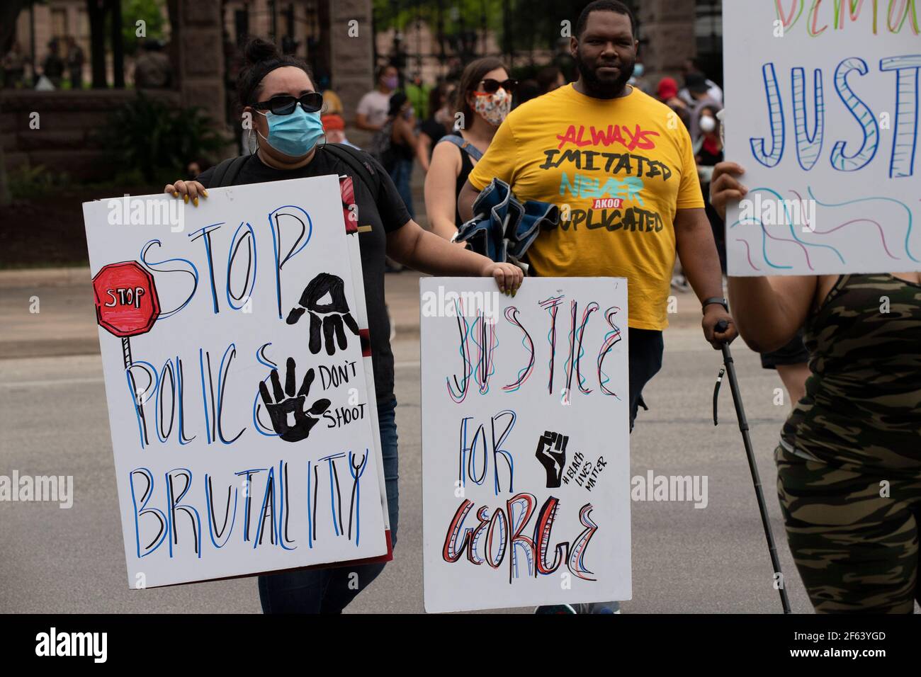 Austin, TX USA May 31, 2020: Protesters march at the State Capitol on the second day of rallies against racism and the police killing of George Floyd last week. An official rally was cancelled by organizers but over 2,000 Texans showed up anyway denouncing  violence, hatred and police brutality. ©Bob Daemmrich Stock Photo