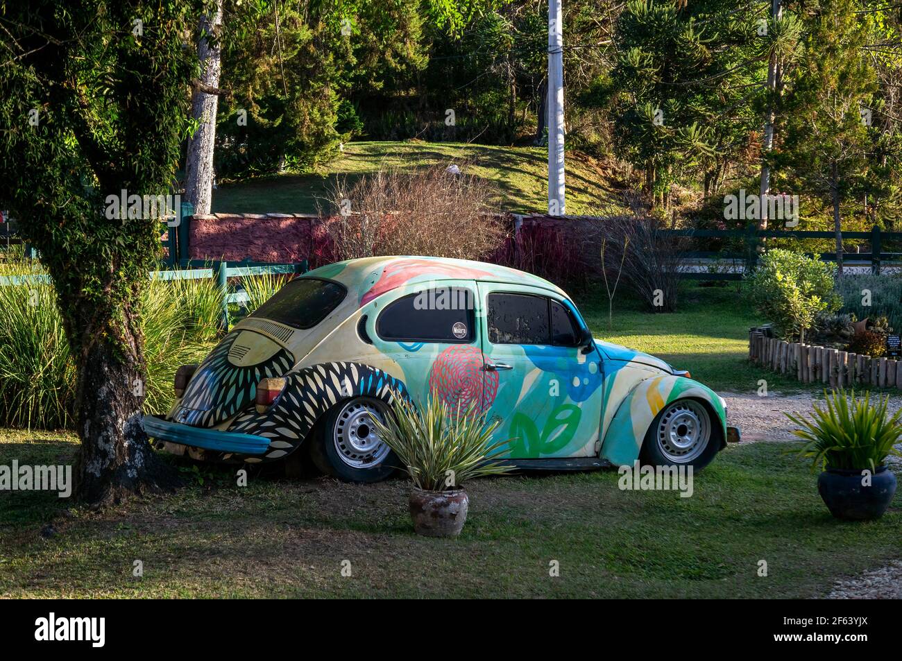 A decorated Volkswagen Beetle used as garden ornament at the front parking lot of Moara Cafe, a known coffee shop located at Salvador Pacetti road. Stock Photo