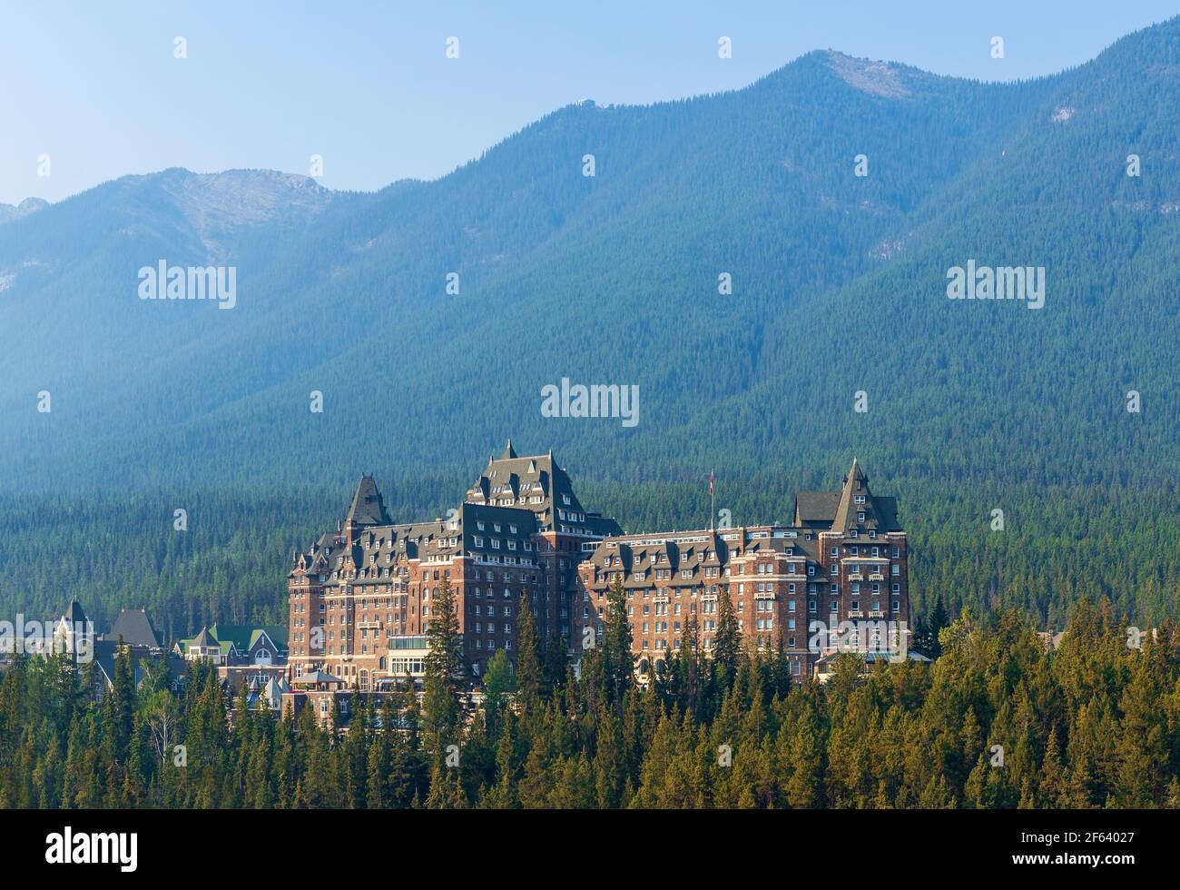 Landscape of pine tree forest with Banff Springs Hotel facade, Banff national park, Alberta, Canada. Stock Photo