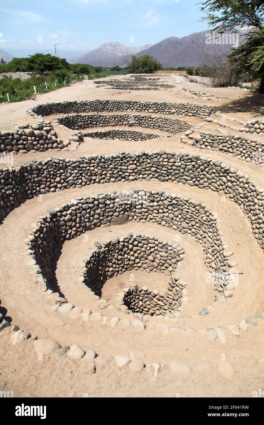 Cantalloc Aqueduct in Nazca or Nazca town, spiral  or circle aqueducts or wells, Peru, Inca architecture and culture Stock Photo