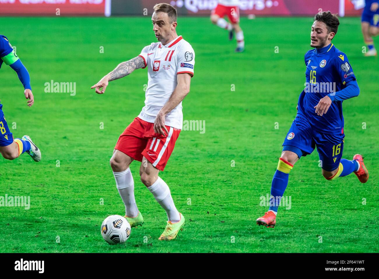 Kamil Grosicki of Poland and Alex Martinez, of Andorra in action during the FIFA World Cup 2022 Qatar qualifying match between Poland and Andorra at Marshal Jozef Pilsudski Legia Warsaw Municipal Stadium. (Final score; Poland 3:0 Andorra) Stock Photo