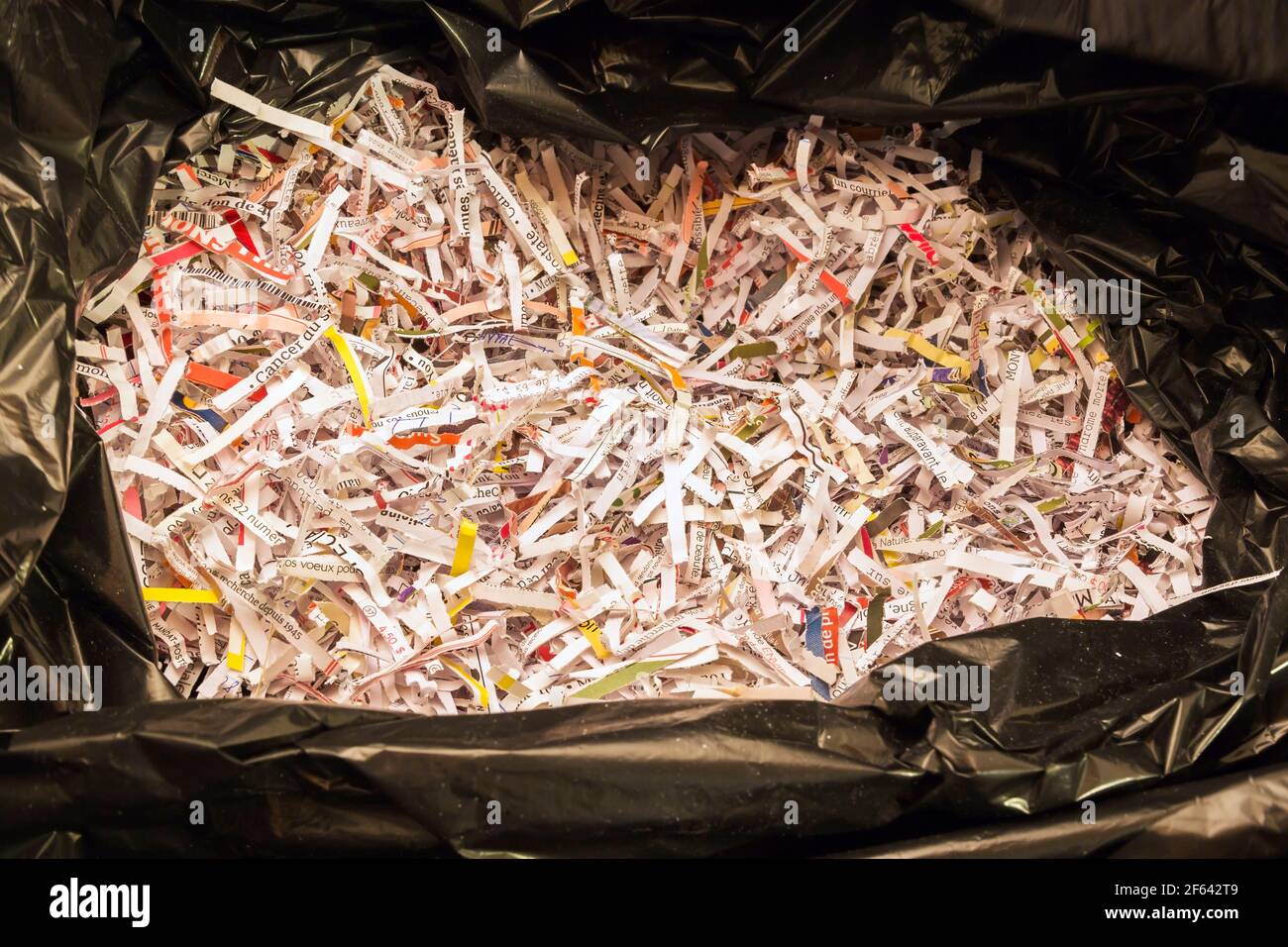 Closeup of shredded paper in black plastic garbage bag Stock Photo Alamy