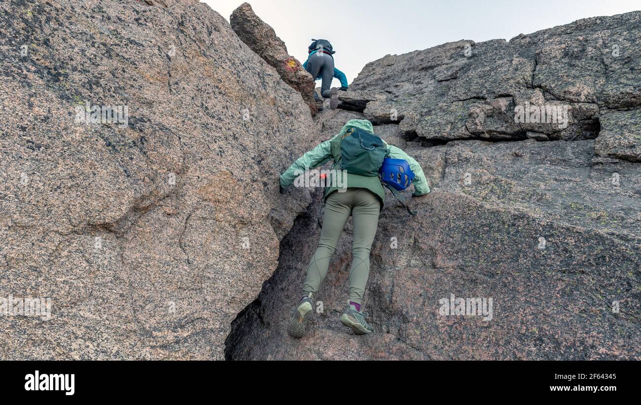 Climbing up through the crux at the top of the Trough, Keyhole route on