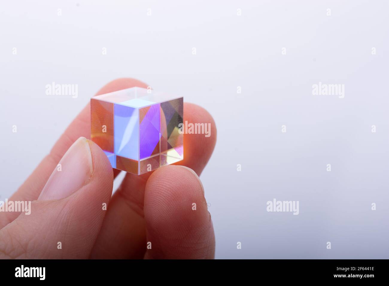 bright luminous prism cubes refract light in different colors. Physics  optics ray refractions Stock Photo - Alamy