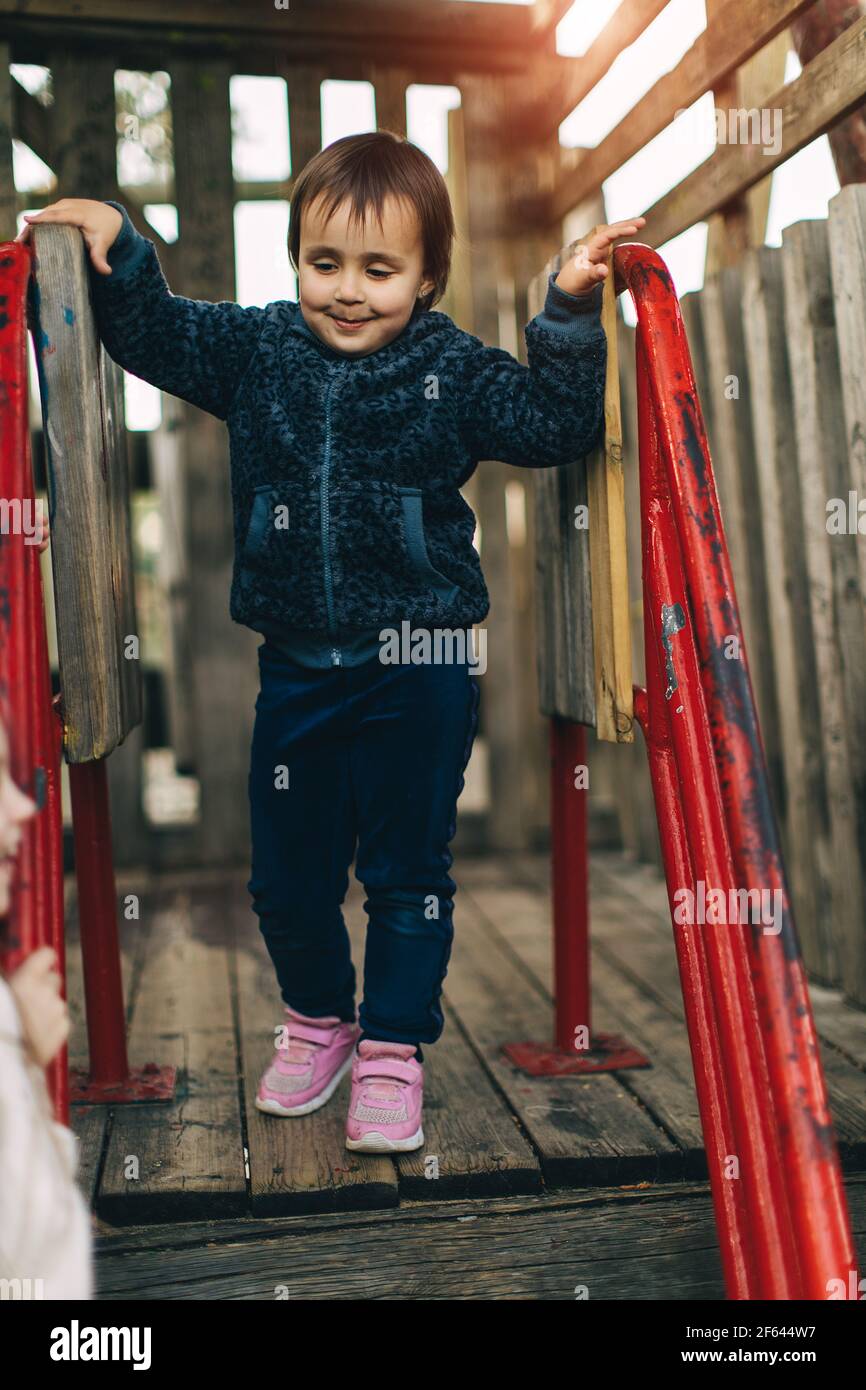 little child playing on playground Stock Photo