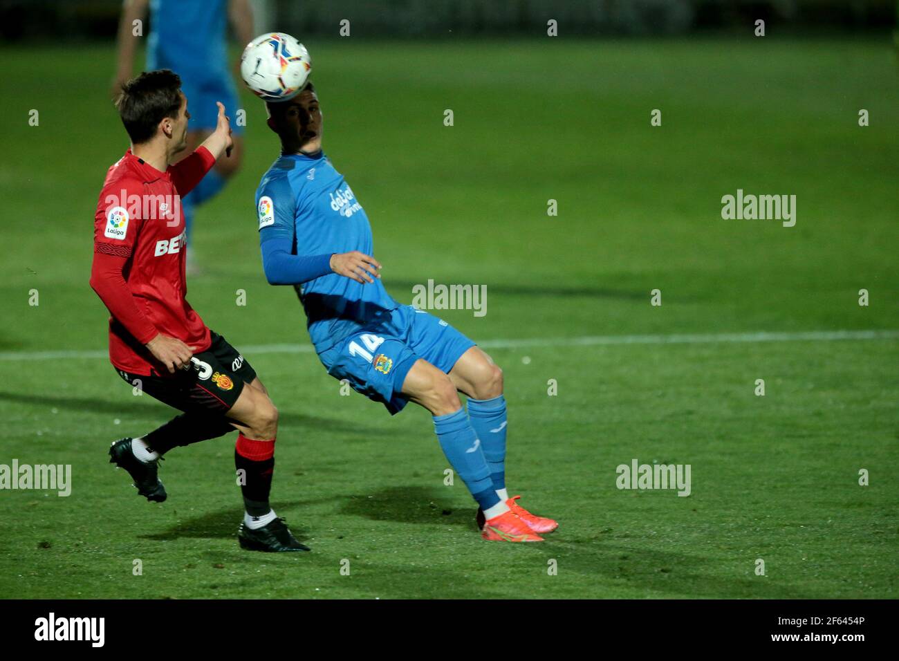 Fuenlabrada, Madrid, Spain, 29.03.2021C. F. Fuenlabrada against R. C. D. Mallorca match of the second division of Spanish soccer in match 31. Fuenlabrada player Oscar Pichi (R)an Mallorca player Brian Olivan (L) Final score 4-1 winner Fuenlabrada with goals from the players Oscar Pichi 13 y 38  Nteka 41  and Pathe Ciss 73  Mallorca scores his player Mboula 56  Photo: Juan Carlos Rojas/Picture Alliance | usage worldwide Stock Photo
