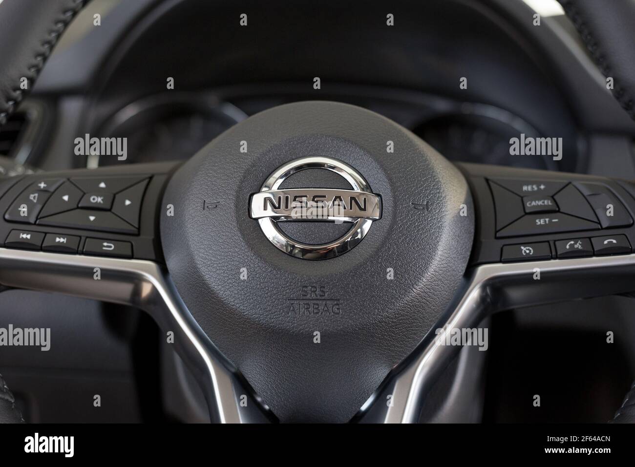 Russia, Izhevsk - February 19, 2021: Nissan showroom. Steering wheel of new Qashqai car with leather cover. Famous world brand. Stock Photo
