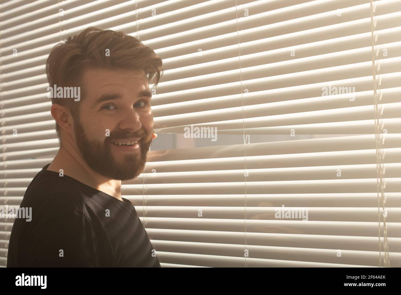 Curious guy looks through window hi-res stock photography and images ...