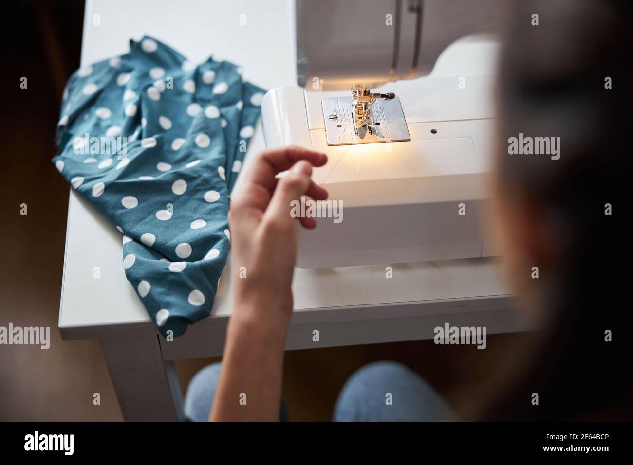 Female child hands using modern sewing machine Stock Photo Alamy